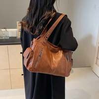 Stylish leather shoulder bag with zipper