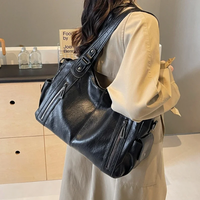 Stylish leather shoulder bag with zipper